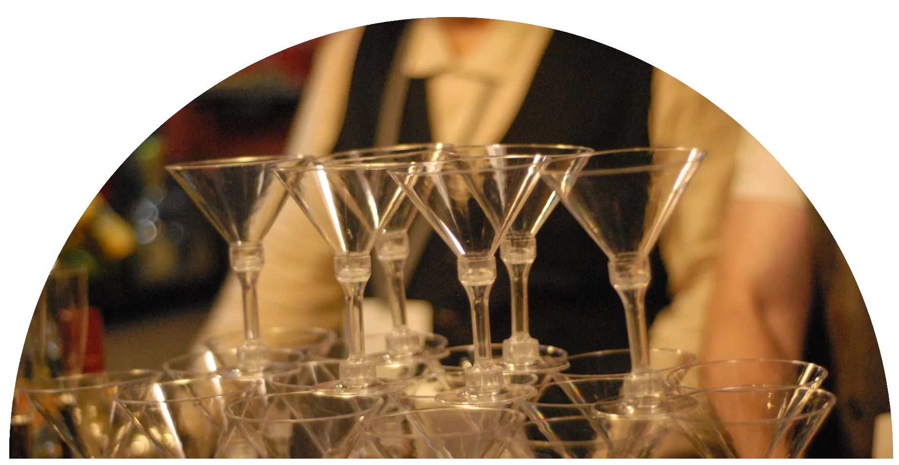 Martini glasses stacked on a bar